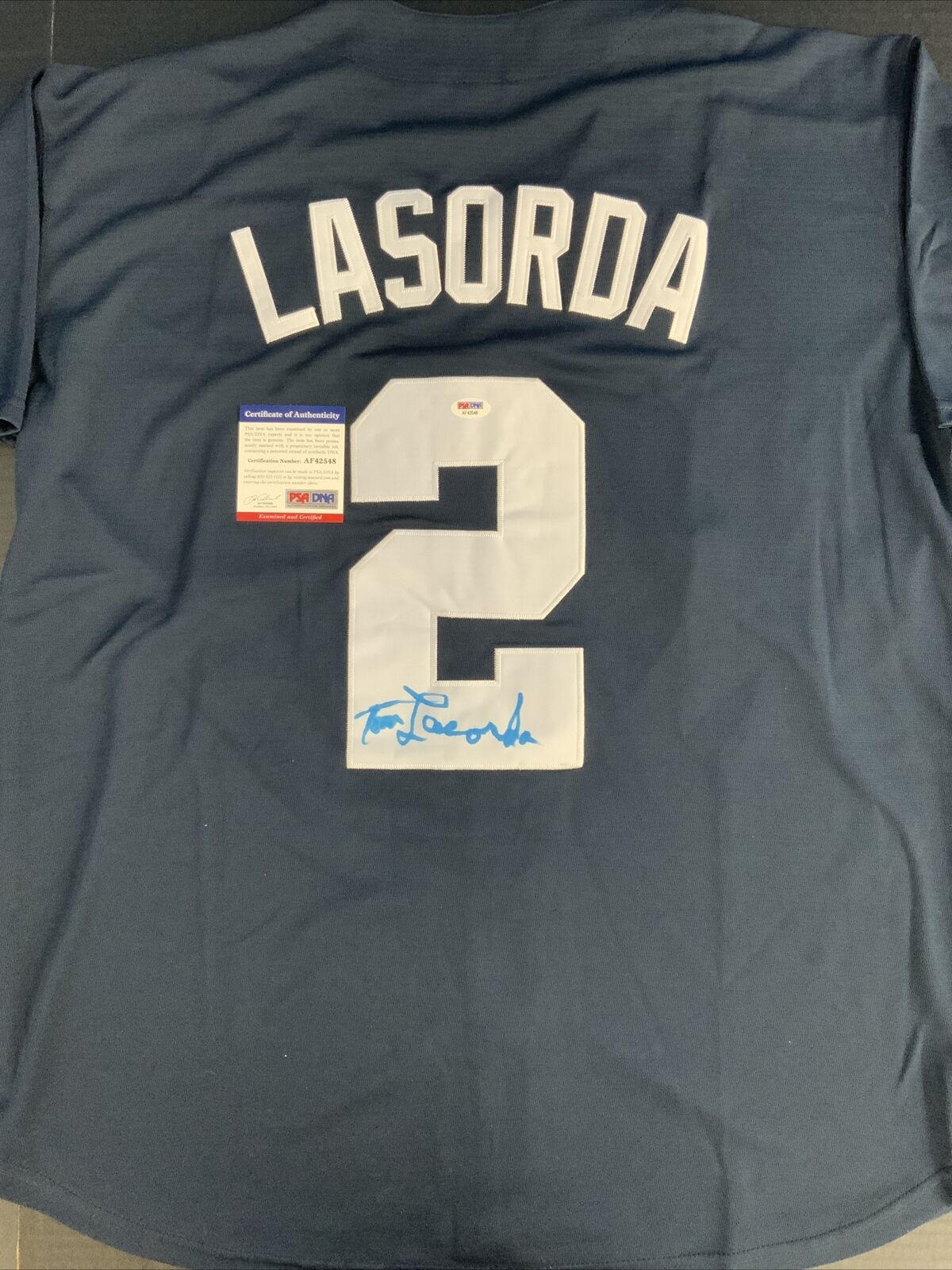 TOMMY LASORDA DODGERS LEGEND SIGNED USA BLUE JERSEY PSA AF42548